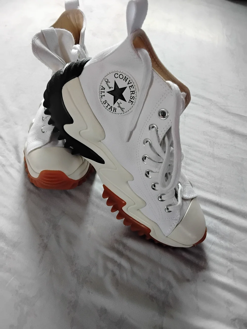 Converse White High-Top Platforms with Black Accents and Orange Outsoles